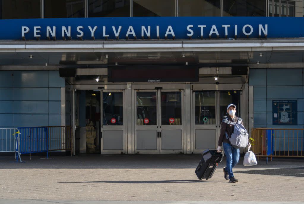 A person is seen wearing a protective face mask outside Pennsylvania Station