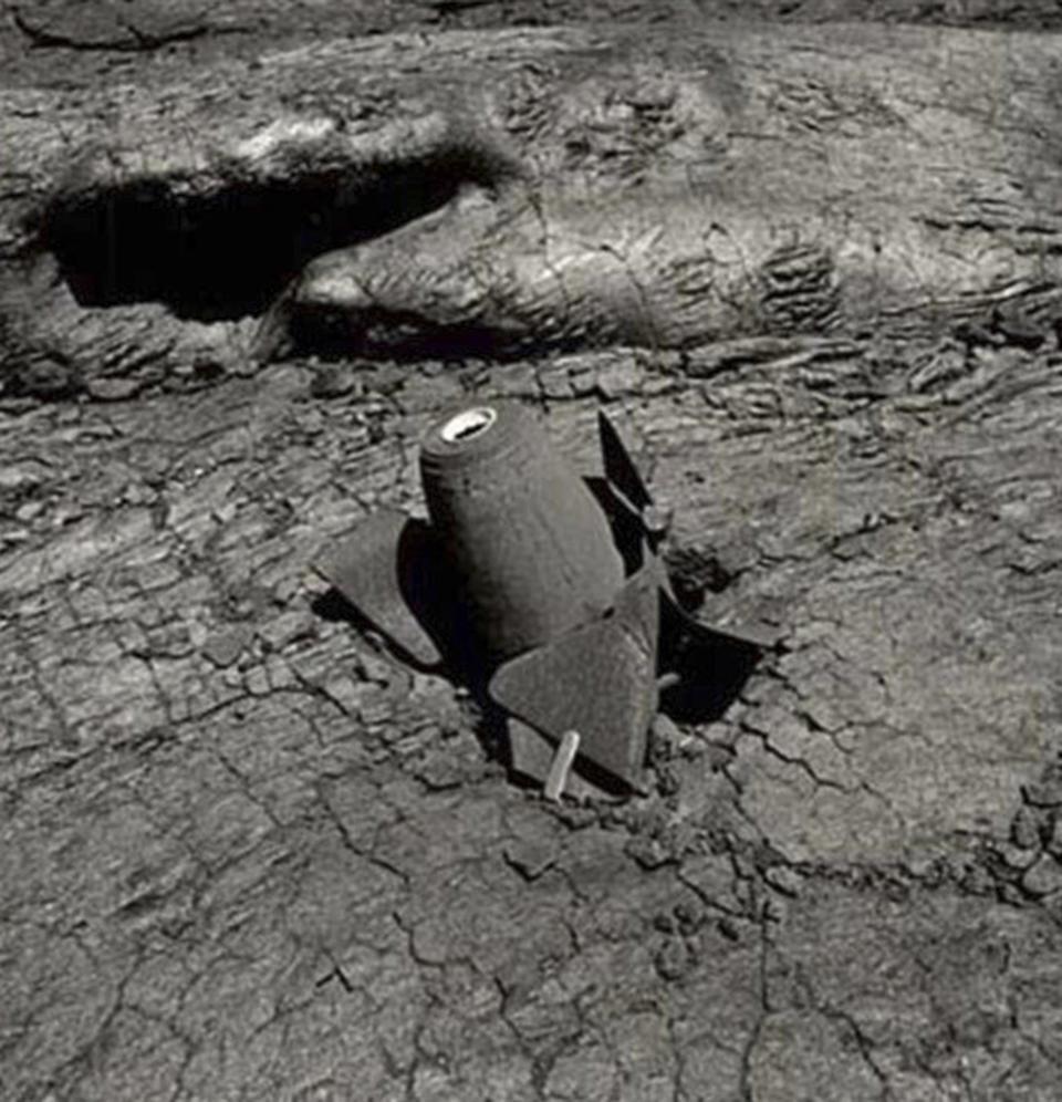 This photo provided by the United States Geological Survey shows one of the bombs dropped on the Mauna Loa 1935 flow. Now Mauna Loa — the world's largest active volcano — is erupting again, and lava is slowly approaching a major thoroughfare connecting the Big Island's east and west sides. (Jack Lockwood/USGS Photo via AP)