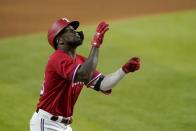 Texas Rangers' Adolis Garcia celebrates his solo home run off a pitch from Seattle Mariners starter Logan Gilbert in the sixth inning of a baseball game in Arlington, Texas, Friday, July 30, 2021. (AP Photo/Tony Gutierrez)