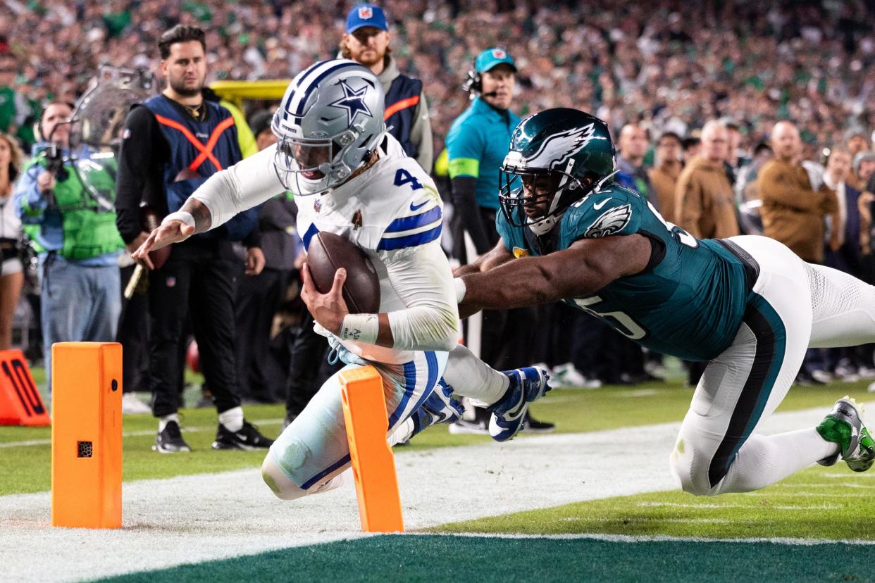 Dallas Cowboys quarterback Dak Prescott steps out of bounds before scoring on a 2-point conversion in Sunday's 28-23 loss to the Philadelphia Eagles at Lincoln Financial Field. Prescott threw four touchdowns.