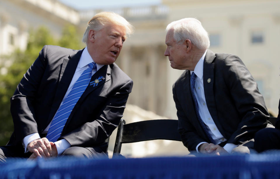 Trump speaks with Sessions at an event in May 2017. (Photo: Kevin Lamarque/Reuters)