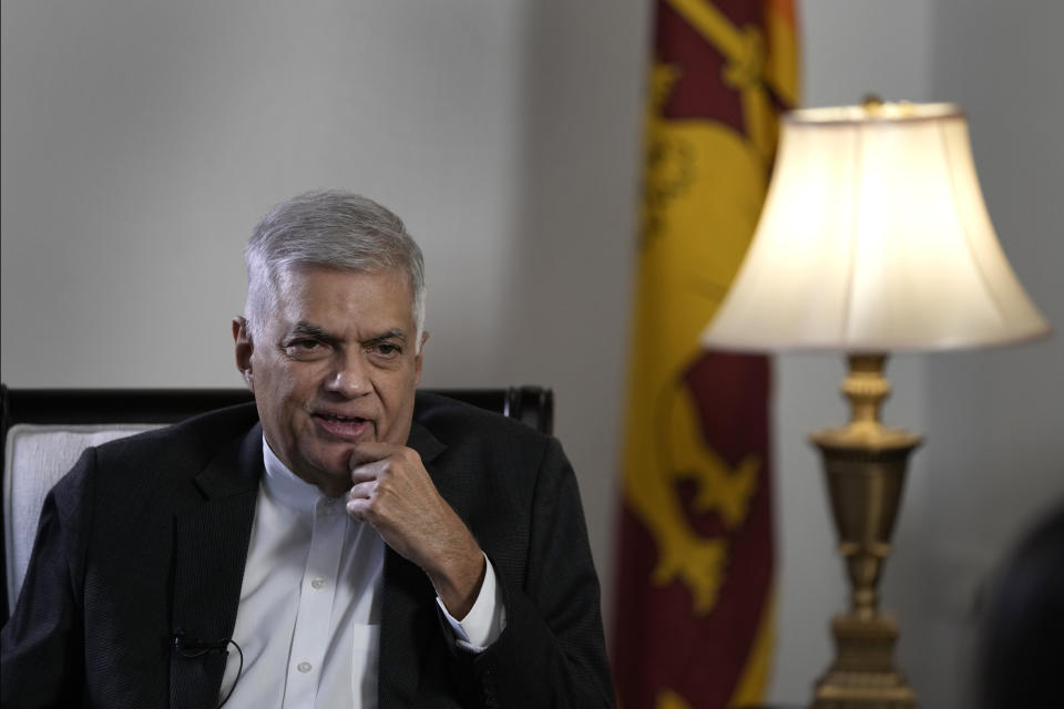 Sri Lanka's new prime minister Ranil Wickremesinghe gestures during an interview with The Associated Press in Colombo, Sri Lanka, Saturday, June 11, 2022. Sri Lanka may be compelled to buy more oil from Russia amid the island nation's unprecedented economic crisis, even as Western nations have largely boycotted Moscow as punishment for its invasion of Ukraine, the newly appointed prime minister said. (AP Photo/Eranga Jayawardena)