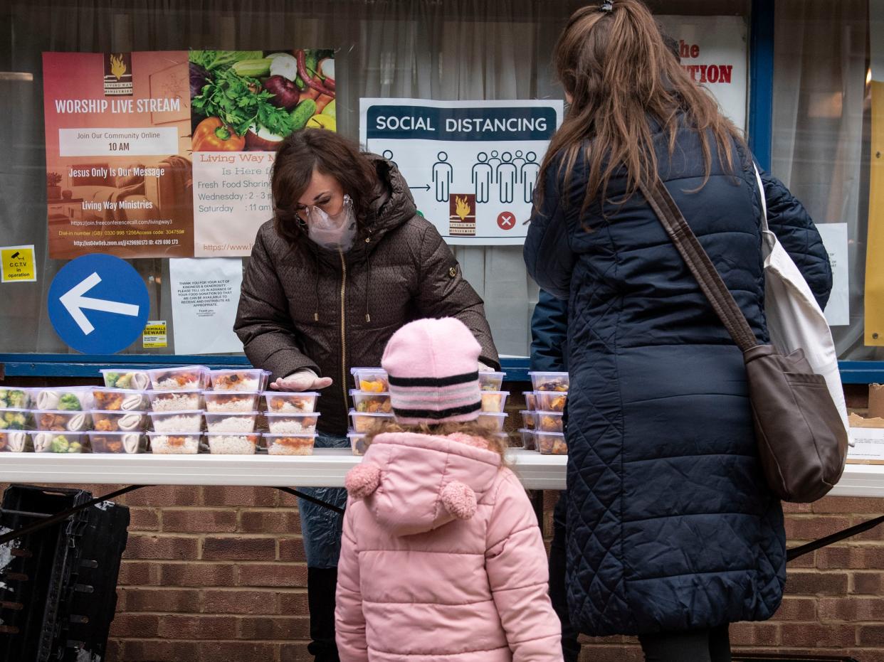 <p>Shirley Ballas, head judge on Strictly Come Dancing, distributes food to people in North West London as part of our campaign</p> (Lucy Young)