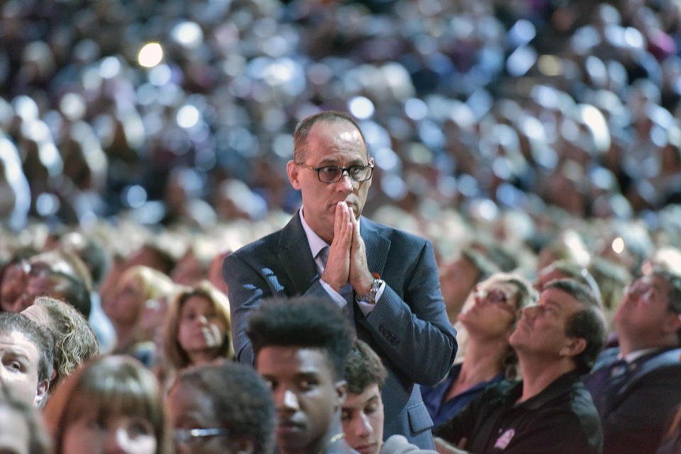 Fred Guttenberg, whose daughter Jaime died in the attack at Marjory Stoneman Douglas, watches a video honoring the 17 students and teachers killed. (Photo: Michael Laughlin/South Florida Sun-Sentinel via AP)