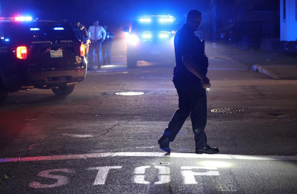 Brockton police and Massachusetts State Police detectives assigned to the Plymouth County district attorney's office investigate a fatal shooting near Tremont and Fulton streets in Brockton on Wednesday, July 5, 2023.