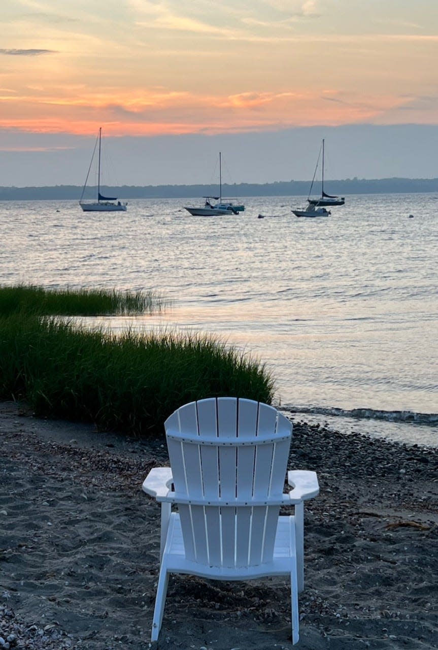 Adirondack chair waits for someone to sit and watch the sunset at Common Fence Point beach. The neighborhood is one in Portsmouth under consideration for increased short-term rental regulations.