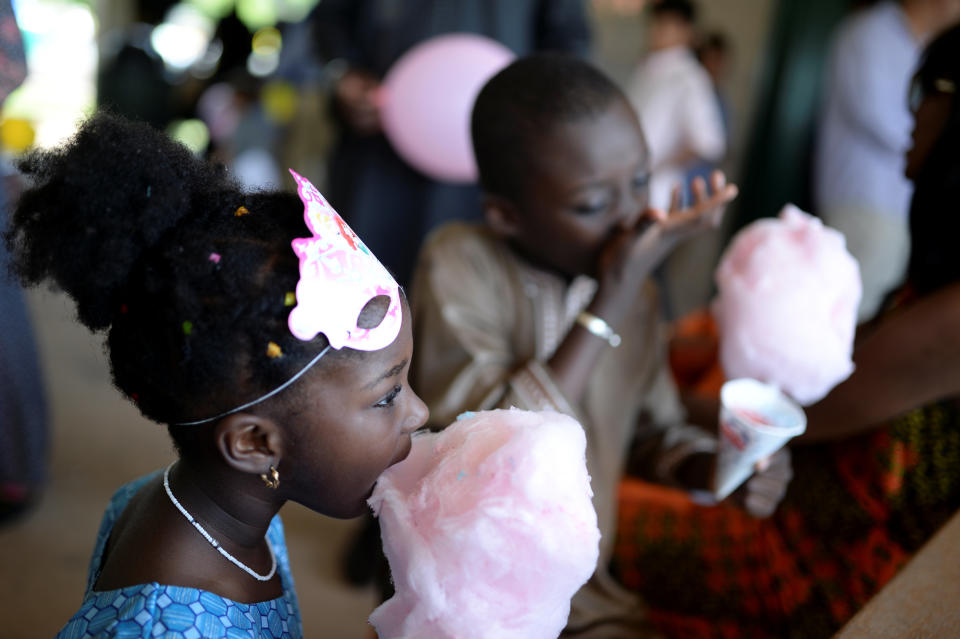 Children eat cotton candy in celebration of Eid al-Fitr at a park in South Brunswick Township, New Jersey, U.S., on June 25, 2017.