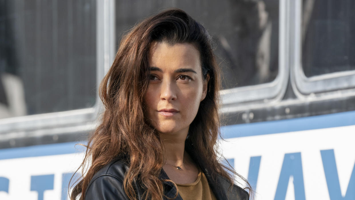  Cote de Pablo's Ziva David standing near a bus in NCIS. 