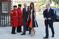 Melania made a diplomatic choice for to visit the Royal Hospital Chelsea wearing a block-colour dress by British designer Victoria Beckham. [Photo: Getty]