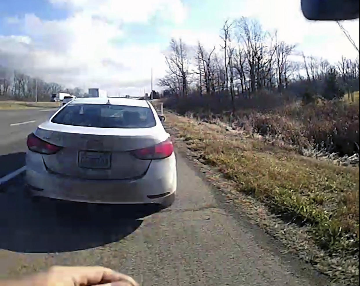 In this image from a bodycam video provided by the Hancock County Sheriff's Office, a white Hyundai Elantra occupied by Bryan Kohberger and his father is seen on a deputy’s body camera video during a traffic stop on Thursday, Dec. 15, 2022, in Hancock County, Ind. Bryan Kohberger, accused in the November slayings of four University of Idaho students, had a first court appearance on Jan. 5, 2023 in Latah County Court in Moscow, Idaho on first-degree murder charges. (Hancock County Sheriff's Office via AP)