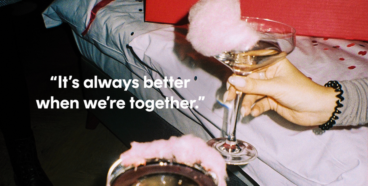 women hold champagne glasses with cotton candy rims