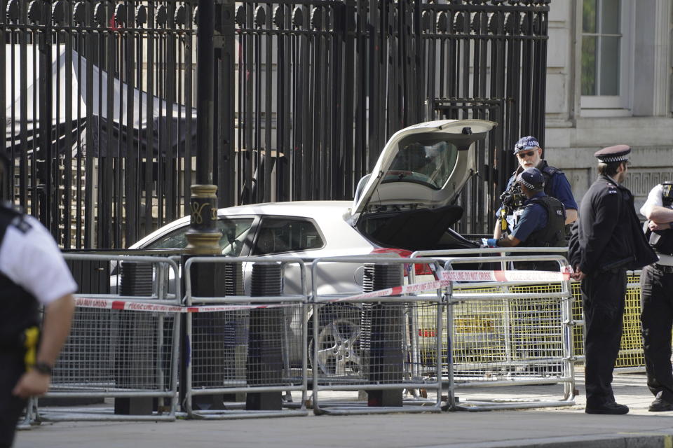 Police at the scene after a car collided with the gates of Downing Street in London, Thursday May 25, 2023. Police say a car has collided with the gates of Downing Street in central London, where the British prime minister’s home and offices are located. The Metropolitan Police force says there are no reports of injuries. Police said a man was arrested at the scene on suspicion of criminal damage and dangerous driving. It was not immediately clear whether the crash was deliberate. (James Manning/PA via AP)