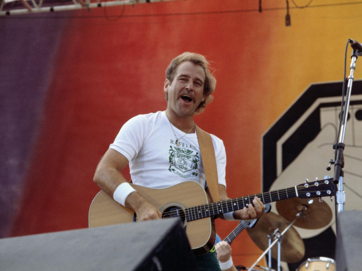 Jimmy Buffett performs at a festival in 1982.