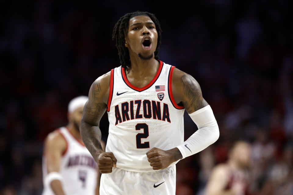 Arizona guard Caleb Love reacts after a basket during the first half of an NCAA college basketball game against Colgate Saturday, Dec. 2, 2023, in Tucson, Ariz. (AP Photo/Chris Coduto)