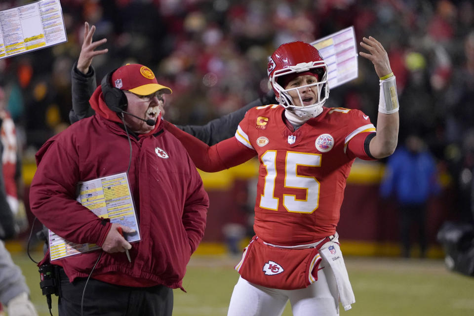Kansas City Chiefs head coach Andy Reid, left, and quarterback Patrick Mahomes (15) react toward officials during the first half of an NFL wild-card playoff football game against the Miami Dolphins Saturday, Jan. 13, 2024, in Kansas City, Mo. (AP Photo/Ed Zurga)