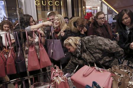 Women shop for handbags at Macy's Herald Square store during the early opening of the Black Friday sales in Manhattan. REUTERS/Andrew Kelly