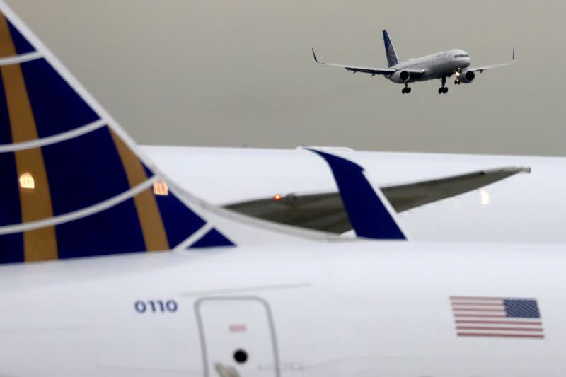 FILE PHOTO: A United Airlines passenger jet lands at Newark Liberty International Airport