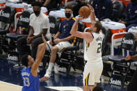 Utah Jazz forward Joe Ingles (2) shoots as Dallas Mavericks guard Jalen Brunson (13) defends in the first half during an NBA basketball game Wednesday, Jan. 27, 2021, in Salt Lake City. (AP Photo/Rick Bowmer)