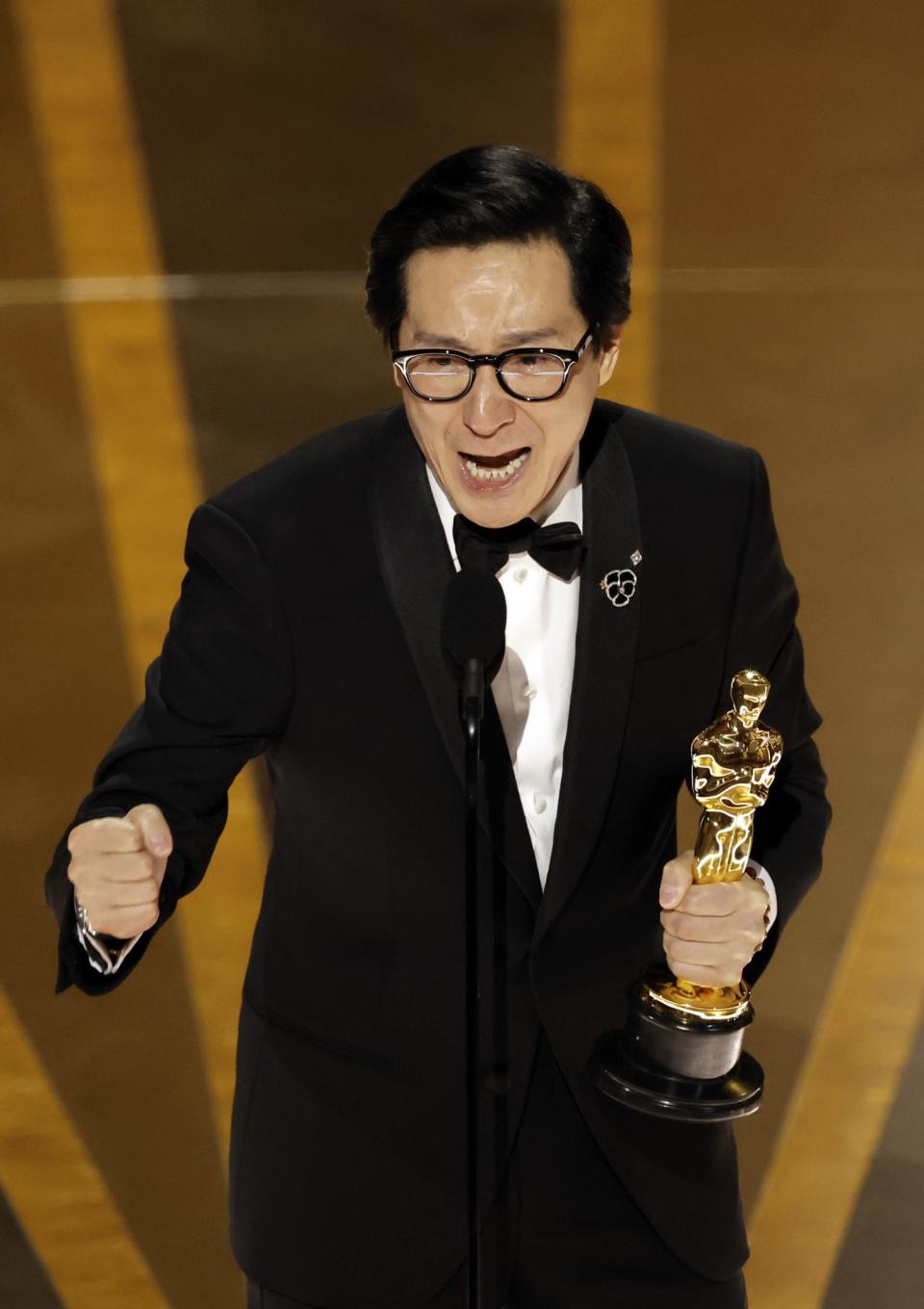 Ke Huy crying as he accepts the Best Supporting Actor award "Everything Everywhere All at Once" onstage during the 95th Annual Academy Awards