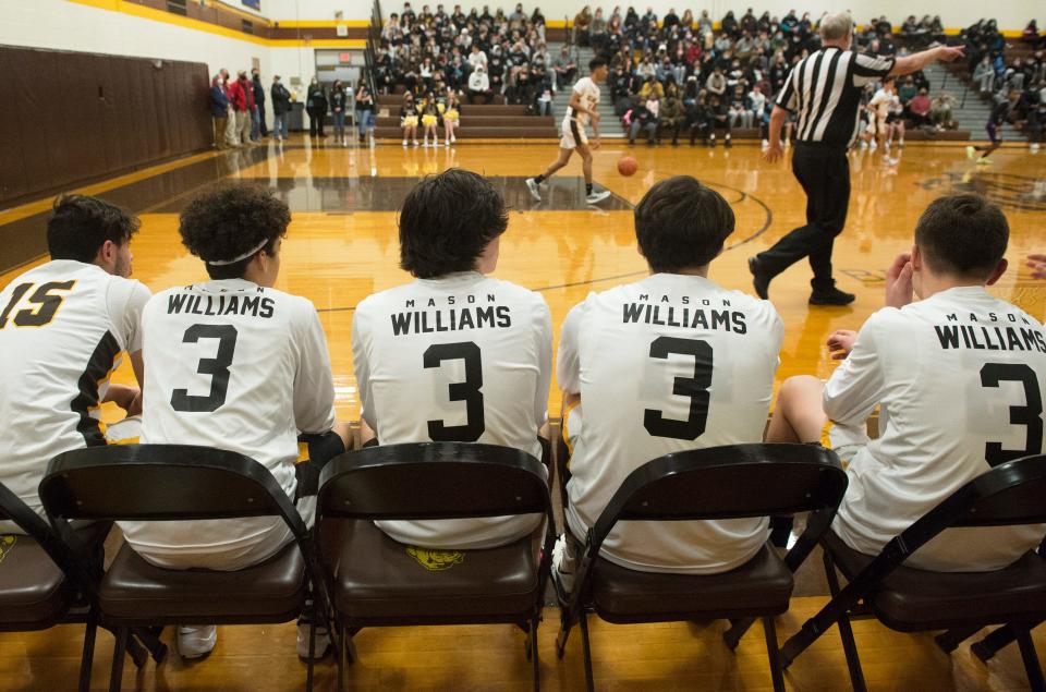 Members of Delran High School's varsity boys basketball team wear shirts in memory of Delran senior Mason Williams as Delran hosted STEMCivics on Tuesday, January 18, 2022.  Williams tragically passed on January 7, 2022.