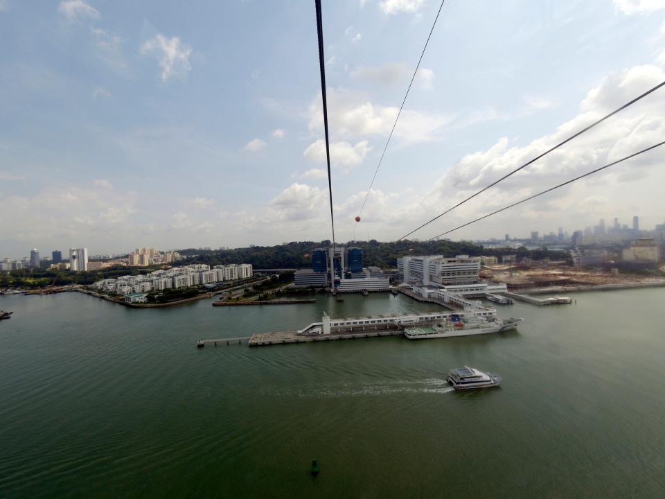 The Singapore Cable Car provides an aerial link from Mount Faber on the main island of Singapore to the resort island of Sentosa across the Keppel Harbour. View from a car of the Singapore side.