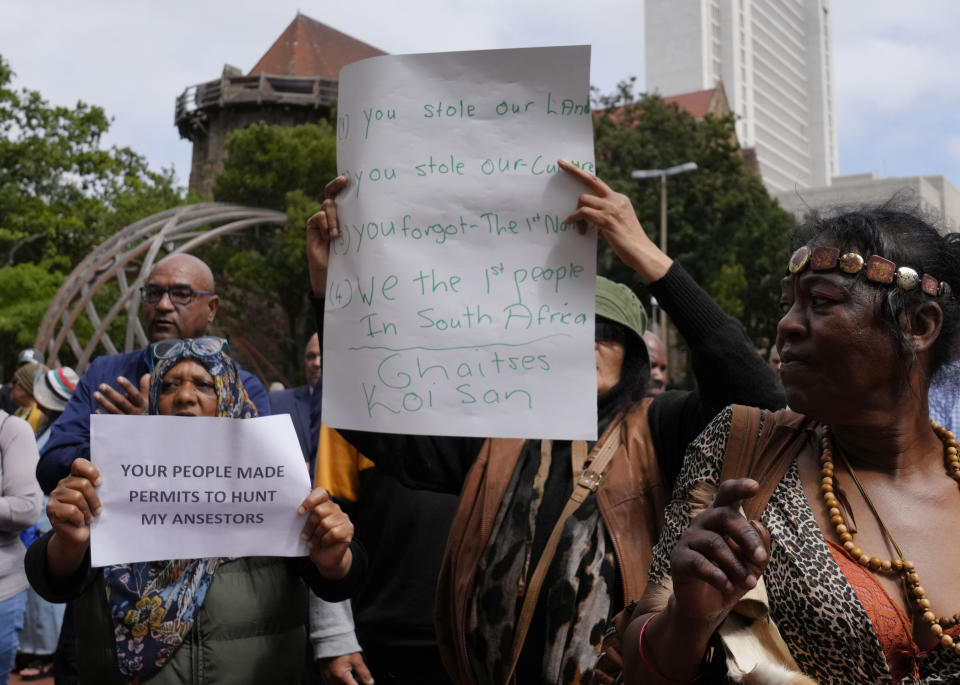 Khoisan protesters protest during the visit of King Willem Alexander and Queen Maxima of the Netherlands at the Slave Lodge in Cape Town, South Africa, Friday, Oct. 20, 2023. The king and queen of the Netherlands were confronted by angry protesters in South Africa on a visit Friday to a monument that traces part of their country's involvement in slavery as a colonial power 300 years ago. (AP Photo/Nardus Engelbrecht)