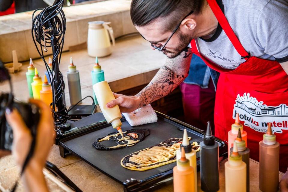 Daniel Drake of Dancakes perfects a pancake portrait. | Sarah Crowder