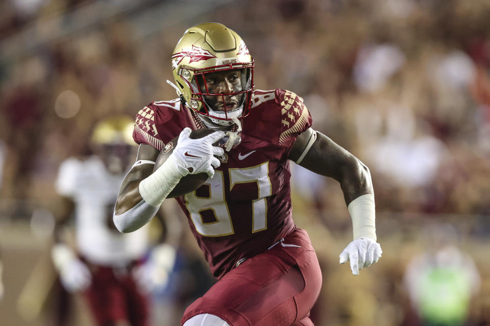 Florida State tight end Camren McDonald (87) runs the ball after a catch on fourth down, gaining a first down during the first quarter of an NCAA college football game against Boston College on Saturday, Sept. 24, 2022, in Tallahassee, Fla. (AP Photo/Gary McCullough)