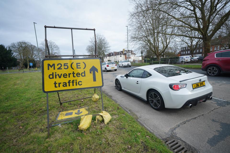 An M25 diversion sign in Byfleet, near to a closed section of the M25 between Junctions 10 and 11 (Yui Mok/PA Wire)