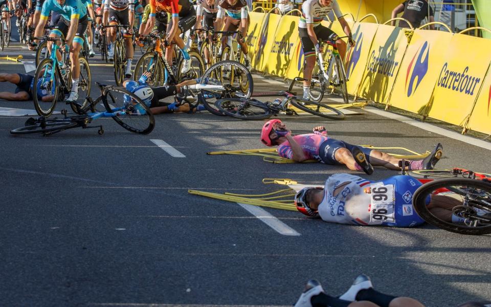 French cyclist Marc Sarreau (no.96) of team Groupama FDJ and other riders lie on the street following a crash in the sprint during the 1st stage of Tour de Pologne cycling race, over 195.8 km between Chorzow and Katowice, southern Poland, 05 August 2020. Dutch cyclist Fabio Jakobsen was put in an induced coma after a crash on stage one of the Tour of Poland on 05 August. Jakobsen crashed into the side barriers following a collision with his fellow Dutch Dylan Groenewegen while sprinting for the finish line. Jakobsen was declared winner of the stage while Groenewegen has been disqualified. - ANDRZEJ GRYGIEL/EPA-EFE/Shutterstock 