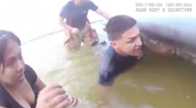 A fire fighter desperately reaches for the boy. Source: Lake Placid Police Department