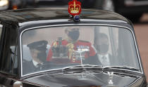 The Imperial State Crown is taken to the Palace of Westminster in London for the State Opening of Parliament, Tuesday May 11, 2021. (AP Photo/Alastair Grant)