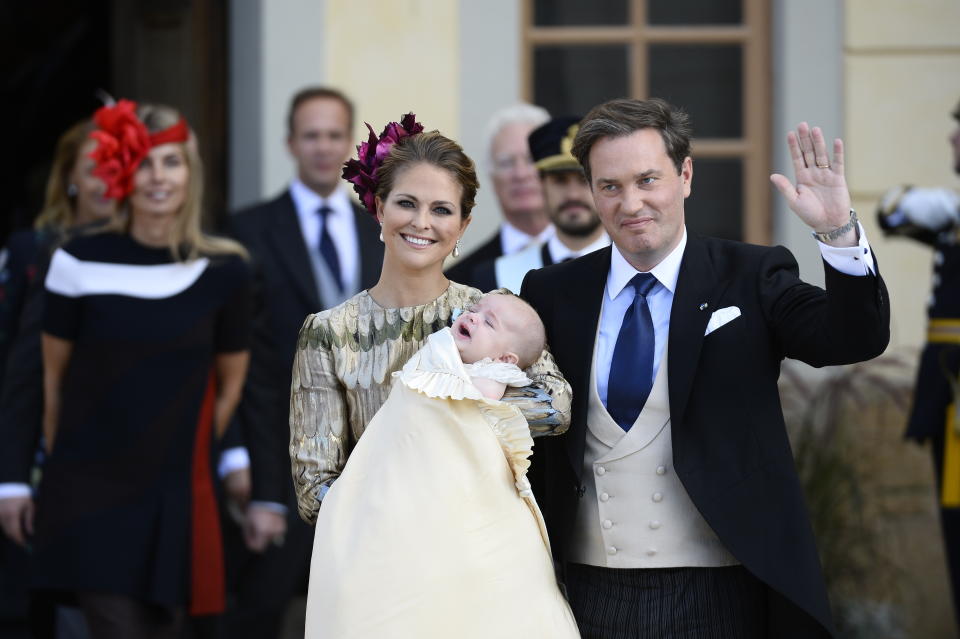 FILE - In this Sunday, Oct. 11, 2015 file photo, Sweden's Princess Madeleine and Christopher O'Neill pose with their son Prince Nicolas after his baptism ceremony, at the Drottningholm Palace Church, near Stockholm, Sweden. As the British royal family wrestles with the future roles of Prince Harry and his wife Meghan, it could look to Europe for examples of how princes and princesses have tried to carve out careers away from the pomp and ceremony of their families’ traditional duties. When Christopher O'Neill, a British-American, married Sweden’s king Princess Madeleine in 2013, he declined a royal title, so he could continue to work as a financier. (Anders Wiklund/TT News Agency via AP, File)