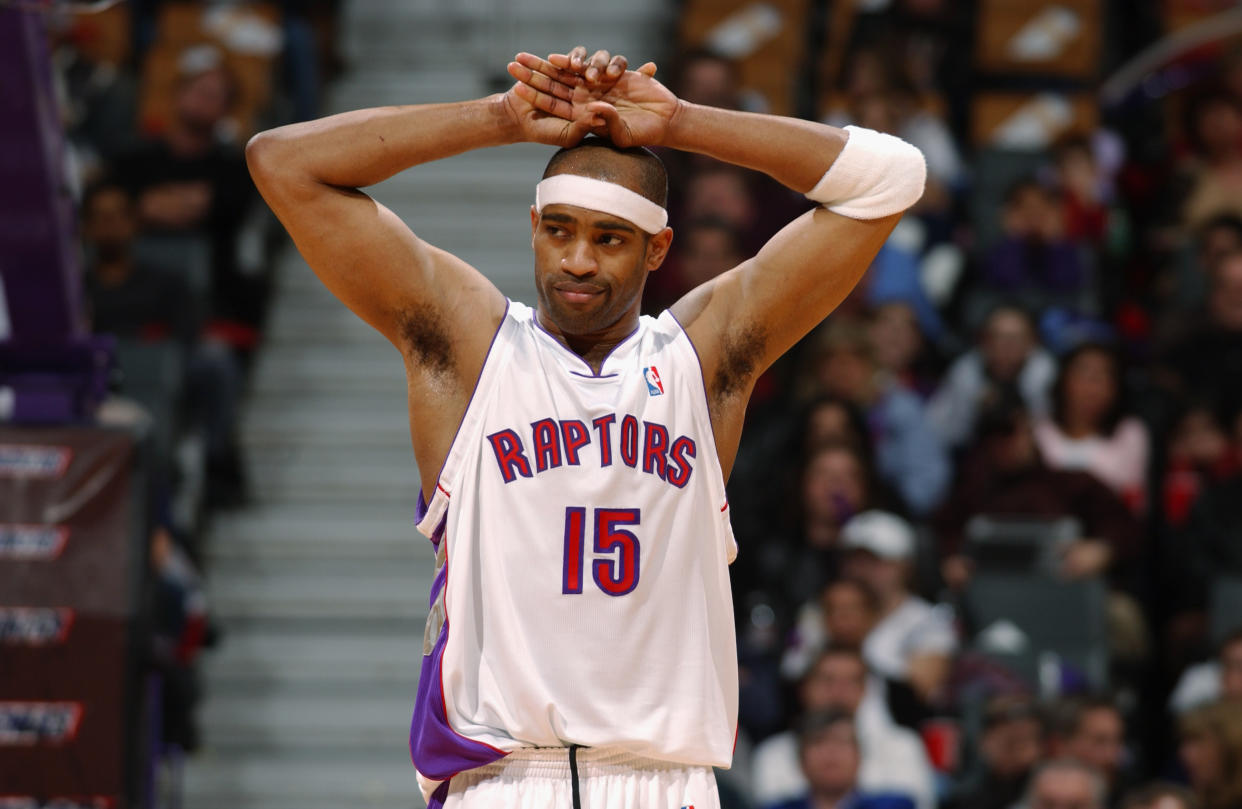 TORONTO - MARCH 14:  Vince Carter #15 of the Toronto Raptors rests during the game against the Atlanta Hawks at Air Canada Centre on March 14, 2004 in Toronto, Canada.  The Raptors won 101-84.  NOTE TO USER: User expressly acknowledges and agrees that, by downloading and/or using this Photograph, User is consenting to the terms and conditions of the Getty Images License Agreement.  (Photo by Ron Turenne/NBAE via Getty Images)