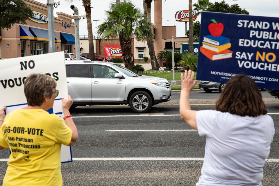 Retired teachers and community members protest with the Corpus Christi American Federation of Teachers against school vouchers and for Proposition 9 on Monday, Oct. 9, 2023, in Corpus Christi, Texas.