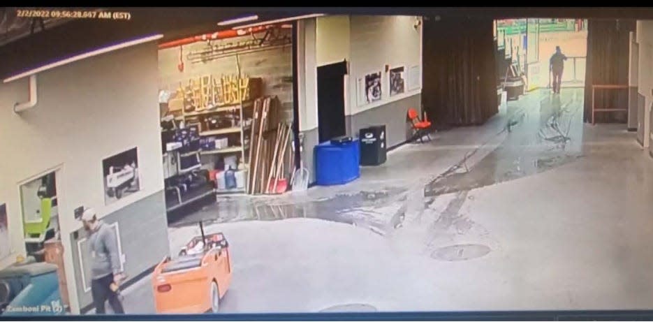 Security camera footage taken on Feb. 2, 2022, shows an ice crew employee, at lower left, glancing through a door at the Zamboni garage, capturing the moment he saw Detroit Red Wings Zamboni driver Al Sobotka peeing into a drain inside the garage. Sobotka was fired over the incident.