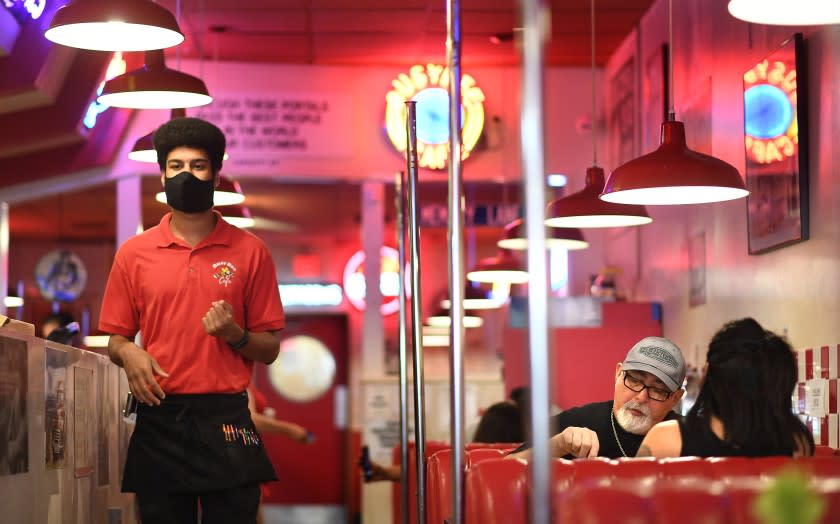 VENTURA, CALIFORNIA MAY 23, 2020-Diners enjoy a meal at BusyBee 50's Cafe in Ventura Saturday. The county lifted a lockdown for sit down dining at all restaurants.(Wally Skalij/Los Angeles Times)