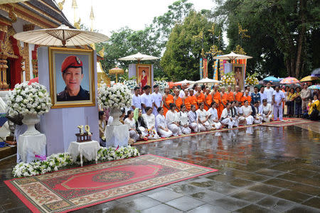 Members of the soccer team rescued from a cave attend a Buddhist ordination ceremony, while honouring the diver who died during their rescue, at a temple at Mae Sai, in the northern province of Chiang Rai, Thailand July 25, 2018. REUTERS/Stringer