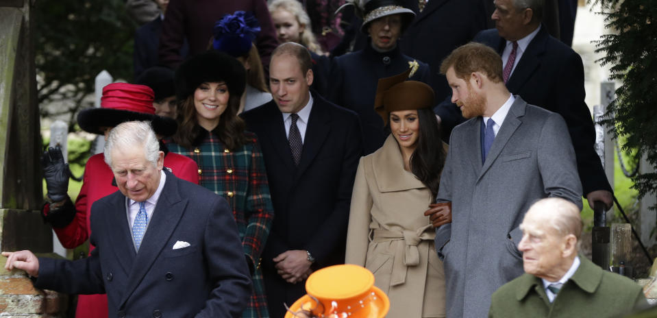 Britain's Prince Charles, left, Kate, Duchess of Cambridge, 2nd left, Price William, Meghan Markle, fiancee of Prince Harry, 2nd right and Prince Philip, right, as they wait for the Queen to leave by car following the traditional Christmas Day church service, at St. Mary Magdalene Church in Sandringham, England, Monday, Dec. 25, 2017. (AP Photo/Alastair Grant)