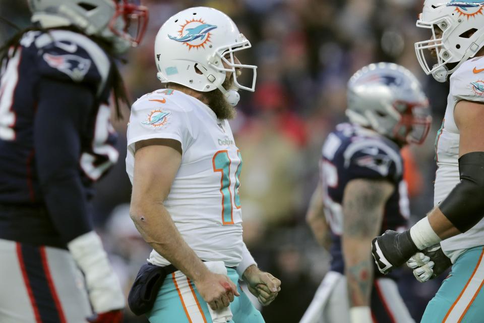 Miami Dolphins quarterback Ryan Fitzpatrick celebrates his winning touchdown pass to Mike Gesicki in the second half of an NFL football game against the New England Patriots, Sunday, Dec. 29, 2019, in Foxborough, Mass. (AP Photo/Charles Krupa)