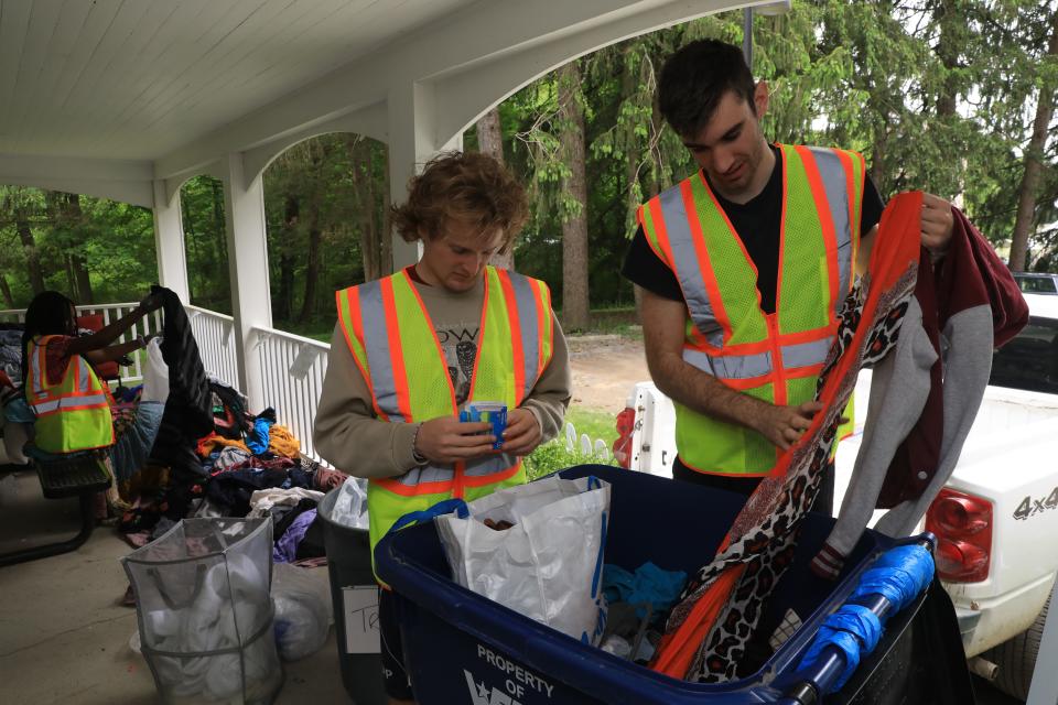 Bard College incoming seniors, from left, Jack Loud and Quincy Ross sort through a donation bin from around campus for Bard's Free-Use Store on May 26, 2022. 