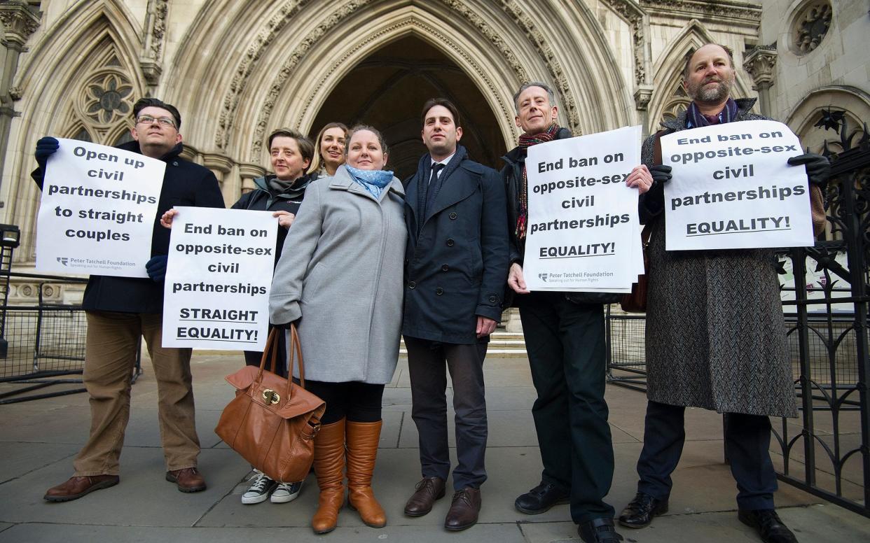Rebecca Steinfeld and Charles Keidan with campaigners outside the High Court at a previous hearing. Credit: Eddie Mulholland for The Telegraph