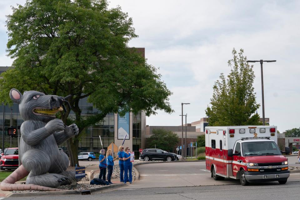 "Scabby the Rat" is inflated at left as nurses and radiology technologists walk the picket line outside of Ascension Providence Rochester Hospital Monday, Sept. 11, 2023 after contract negotiations between the Office and Professional Employees International Union (OPEIU) Local 40 and the hospital broke down.