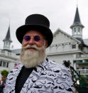 <p>A man sports both a well-groomed beard and a mustache-themed coat. (Photo: Getty Images) </p>