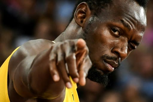 Bolt gestures to the crowd at his final World Championships appearance in 2017