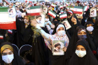 Supporters of Iranian president-elect Ebrahim Raisi celebrate after he won the presidential election in Tehran, Iran, Saturday, June 19, 2021. Initial results released Saturday propelled Raisi, a protege of the country's supreme leader, into Tehran’s highest civilian position. The vote appeared to see the lowest turnout in the Islamic Republic’s history. (AP Photo/Ebrahim Noroozi)