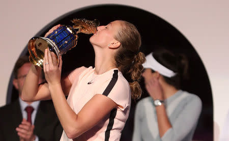 Tennis - WTA Premier 5 - Qatar Open - Finals - Doha, Qatar - February 18, 2018. Petra Kvitova of Czech Republic kisses the trophy after defeating Gabrine Muguruza of Spain. REUTERS/Ibraheem Al Omari