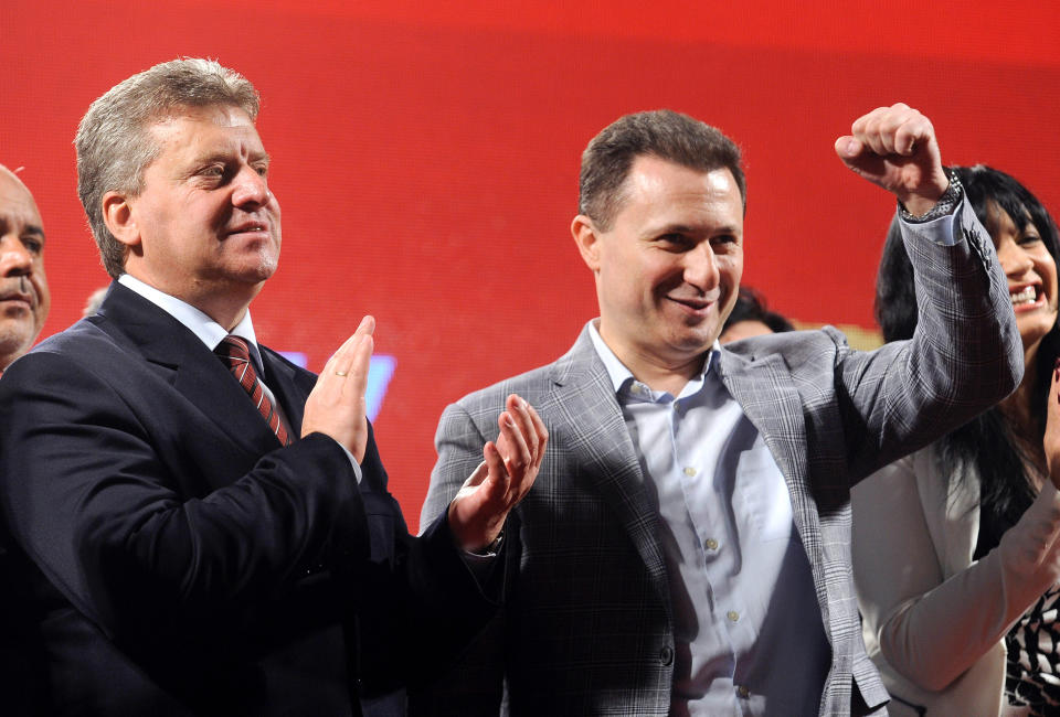 In this picture taken Tuesday, April 22, 2014, Macedonian Prime Minister and leader of VMRO-DPMNE Nikola Gruevski, right and Gjorge Ivanov, left, current Macedonian President and a candidate of the ruling conservative VMRO-DPMNE, greet their supporters during a campaign rally in Macedonia's capital Skopje. Macedonia is to hold snap general elections this Sunday, as well as the second round of presidential elections. Nearly 1.8 million voters are eligible to cast their ballots at more than 3,500 polling stations, including those in diaspora. (AP Photo/Boris Grdanoski)