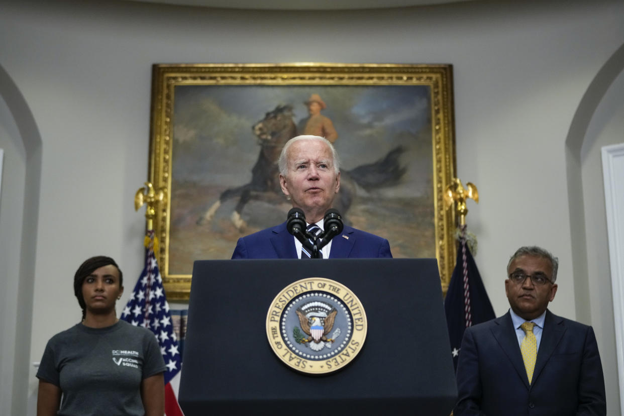 President Biden stands at a podium at the White House.