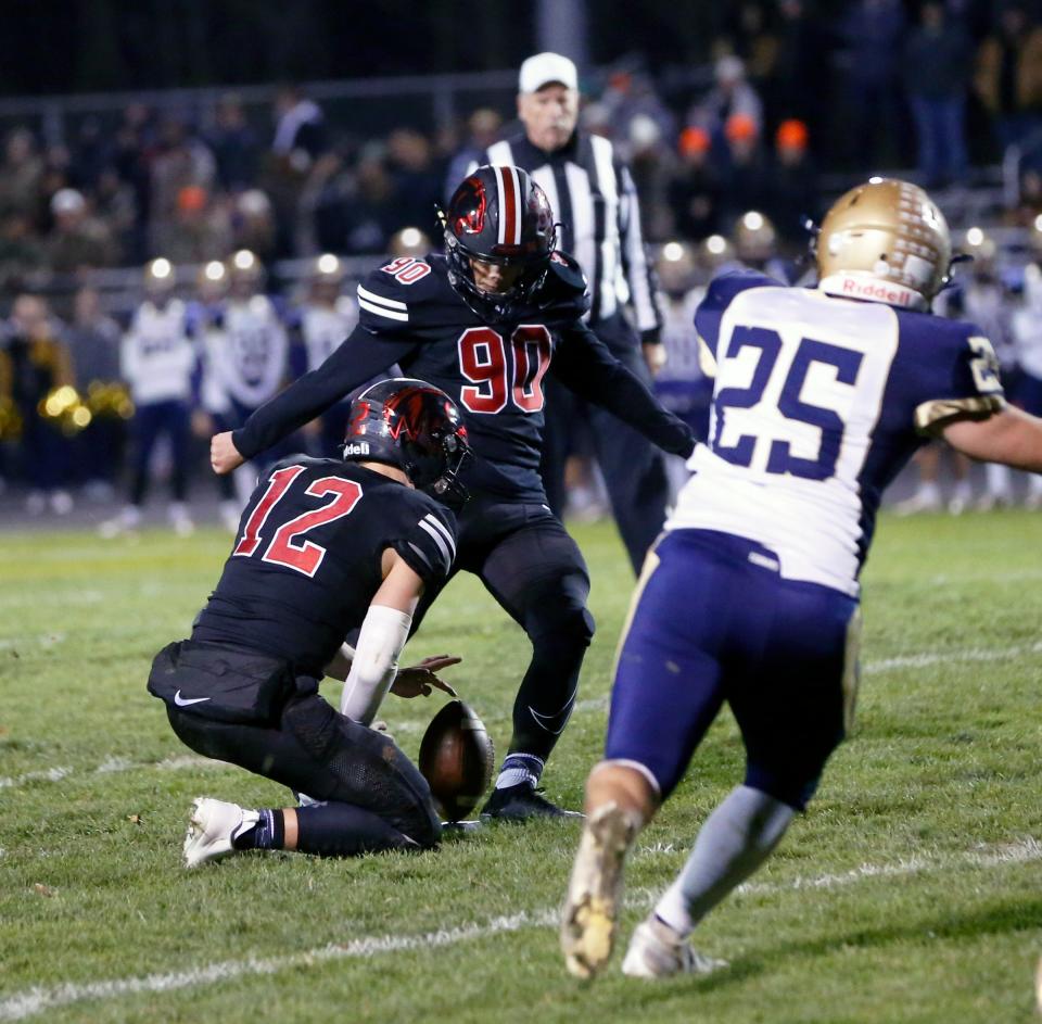 NorthWood junior Dominic De Freitas (90) connects on a 47-yard field goal as time expires in the first half of the Class 4A football regional championship game against New Prairie Friday, Nov. 10, 2023, at NorthWood High School in Nappanee.